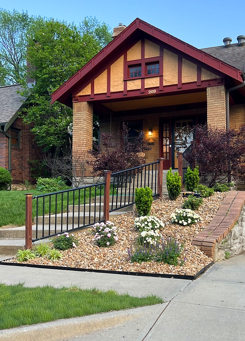 Neat landscaping in front of nice home