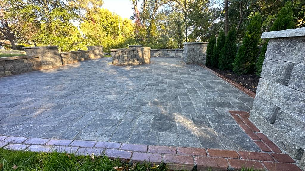 Residential landscape design in Kansas City showing backyard fence, expanded grass lawn, reduced driveway, and minimal foundation planting beds