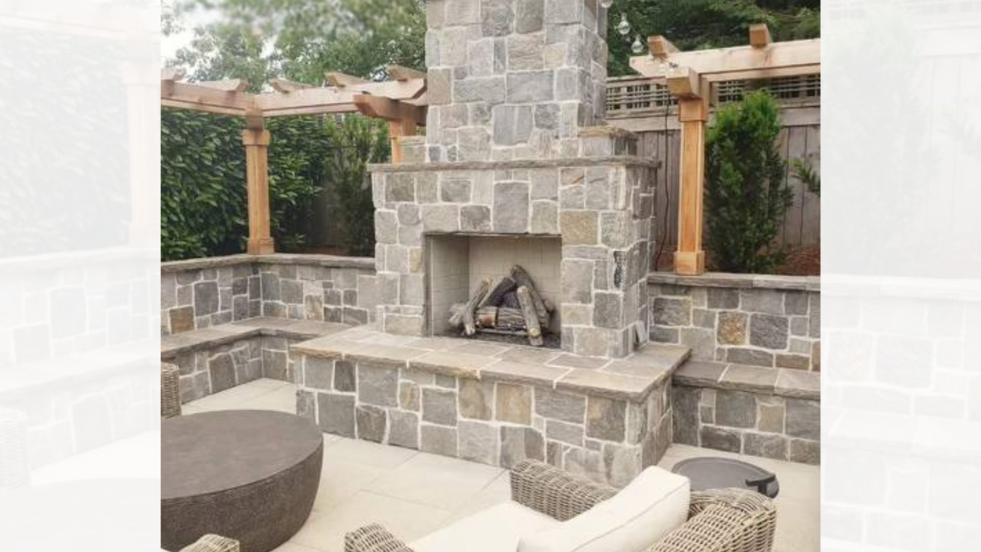 Outdoor stone fireplace with pergola, seating walls, and patio seating area.