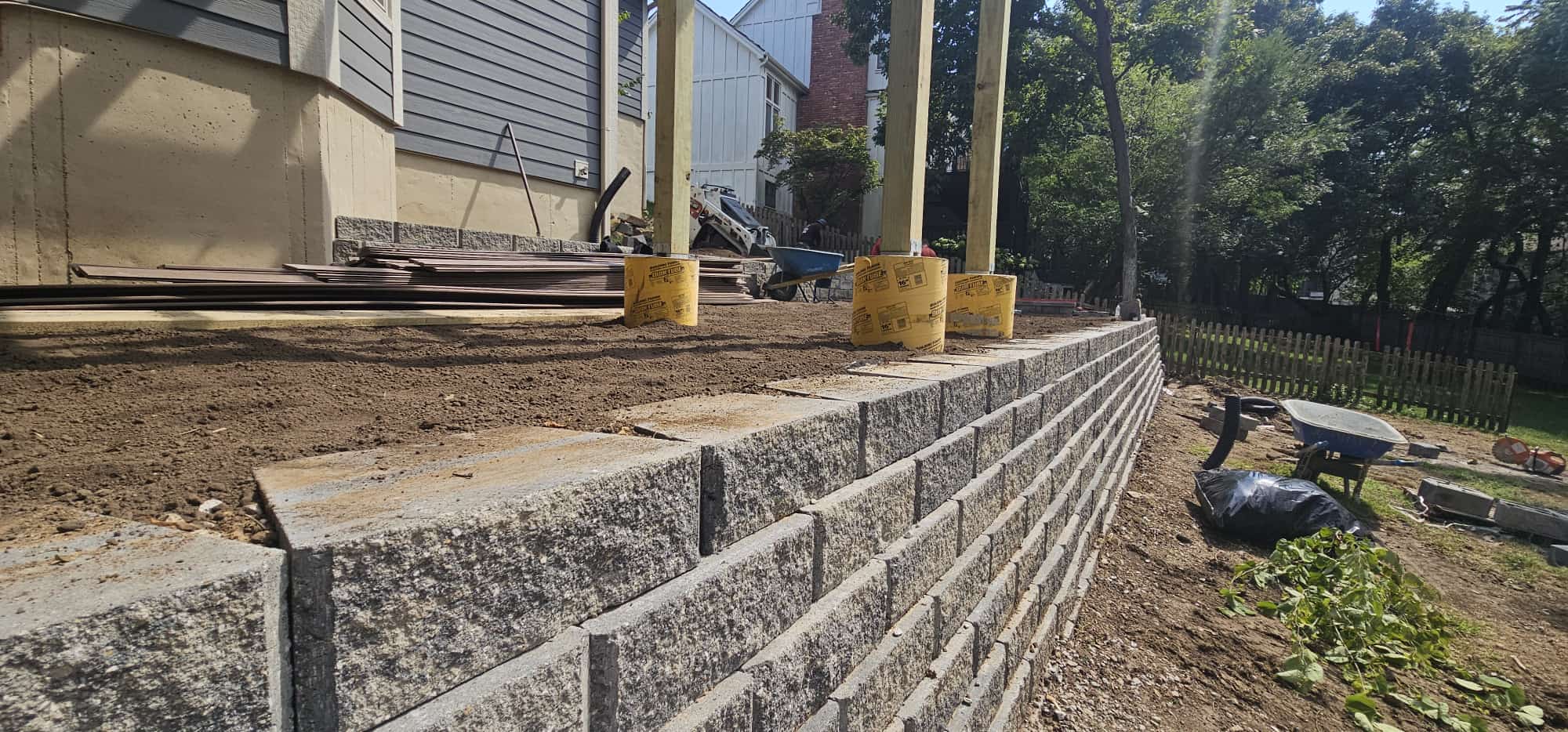 Retaining wall installation in progress by Mountain Landscaping